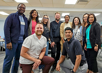 Servus employees pose for a group picture